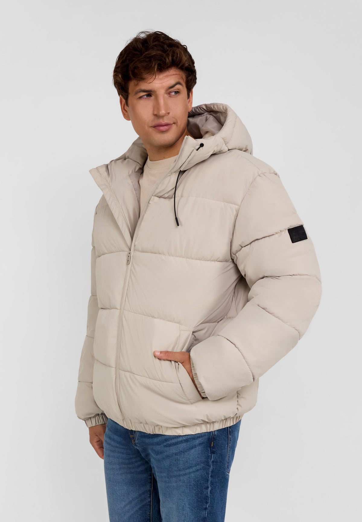 Men's light beige puffer jacket, shown worn.