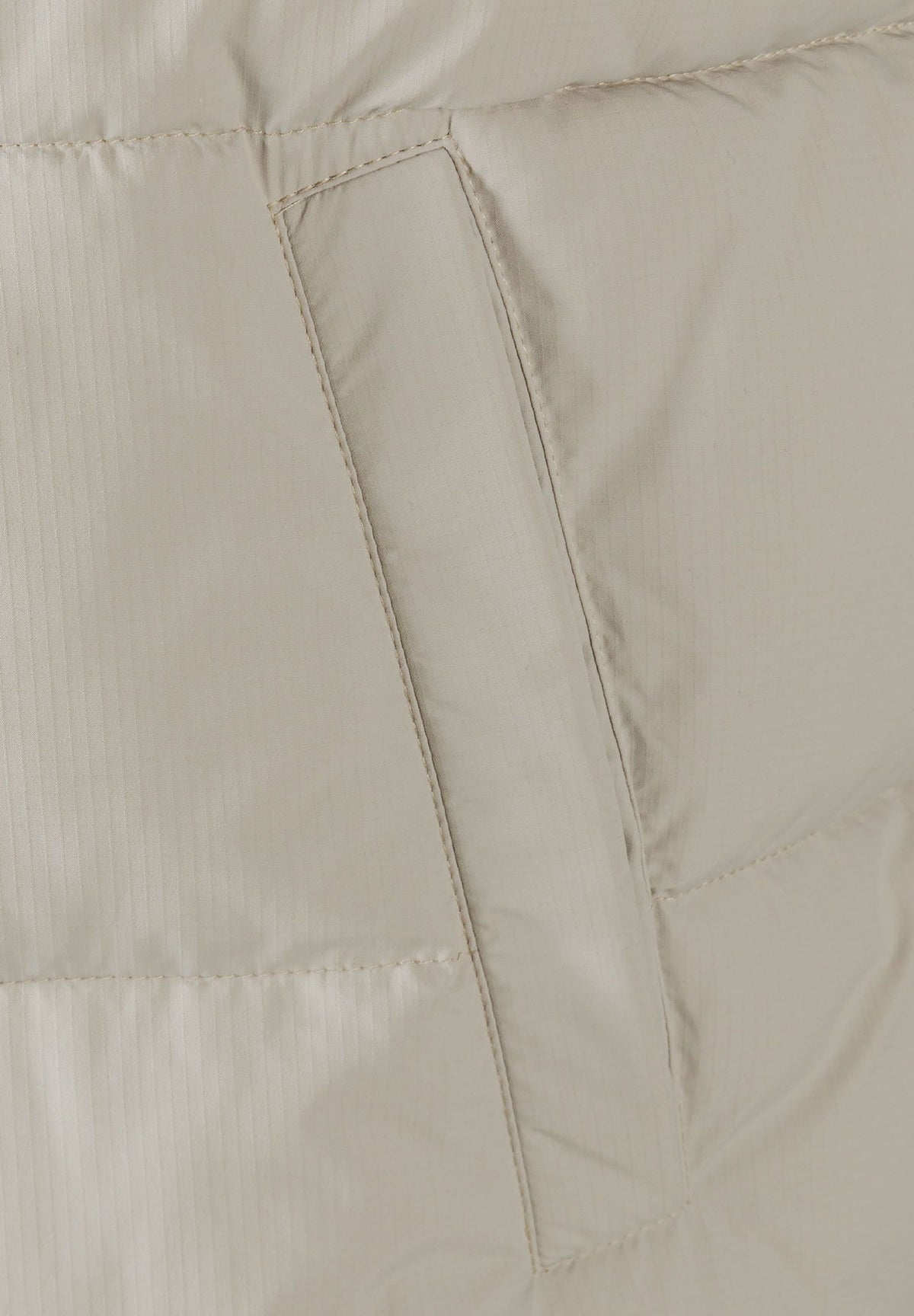 Light grey padded gilet, pocket detail.
