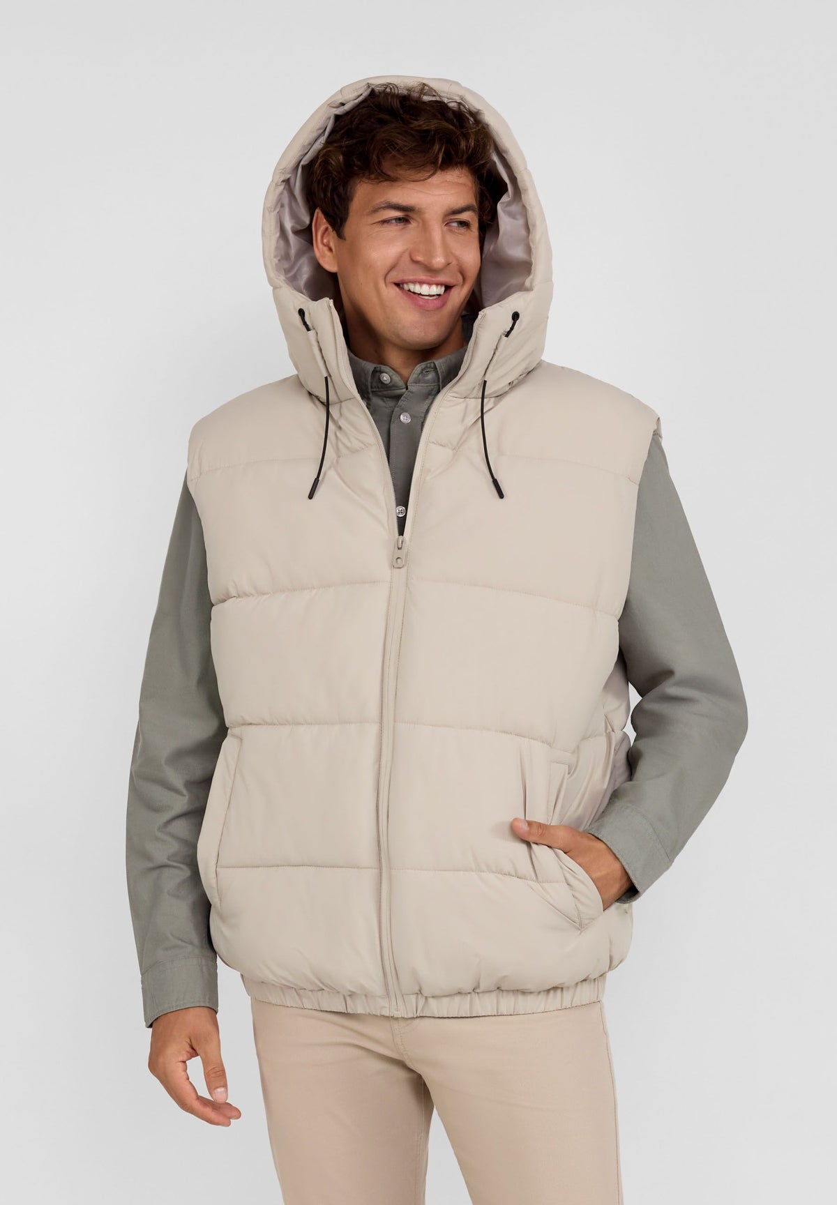 Light grey padded gilet, model front.