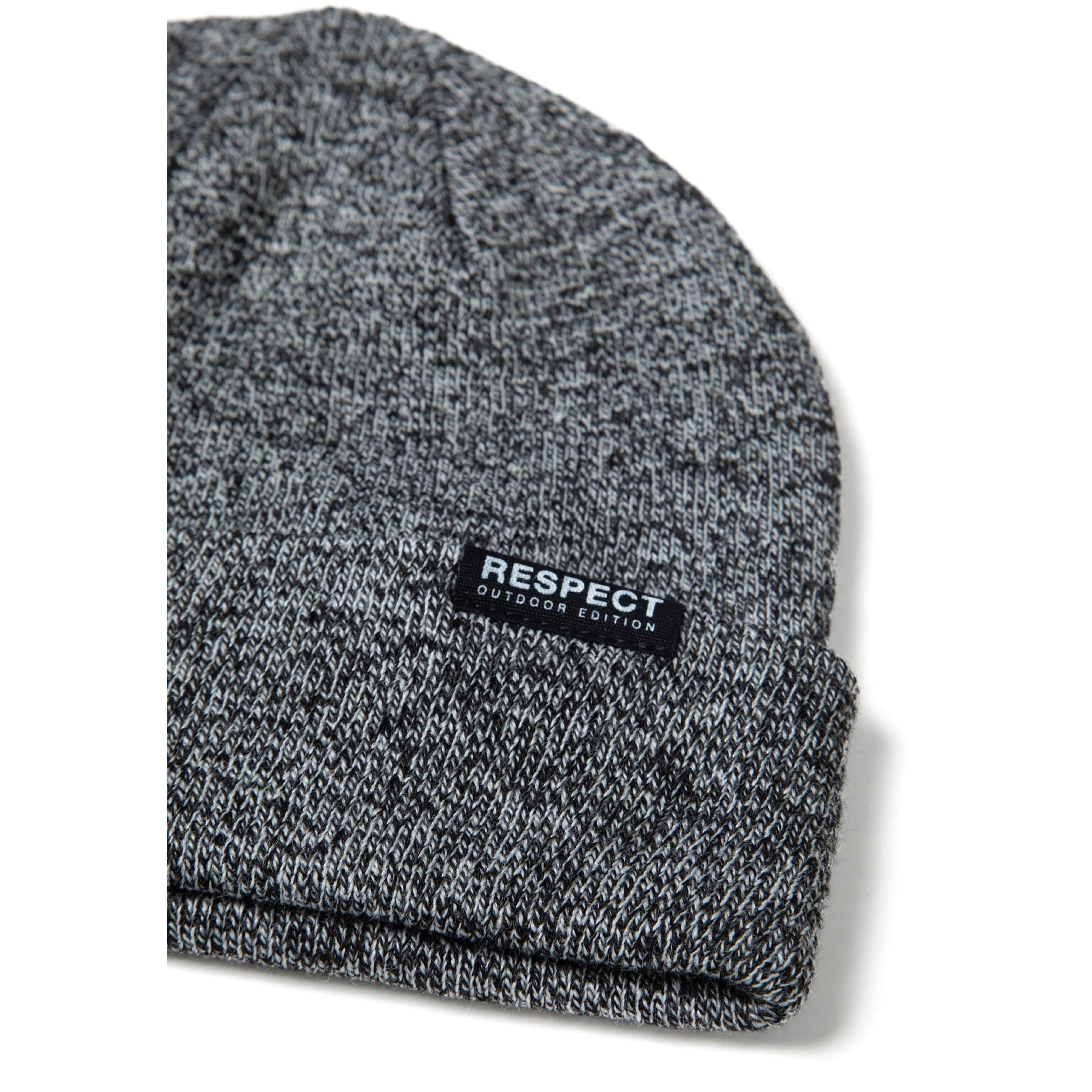Close-up detail of grey knitted beanie showing fold-up cuff and black Respect Outdoor Edition label