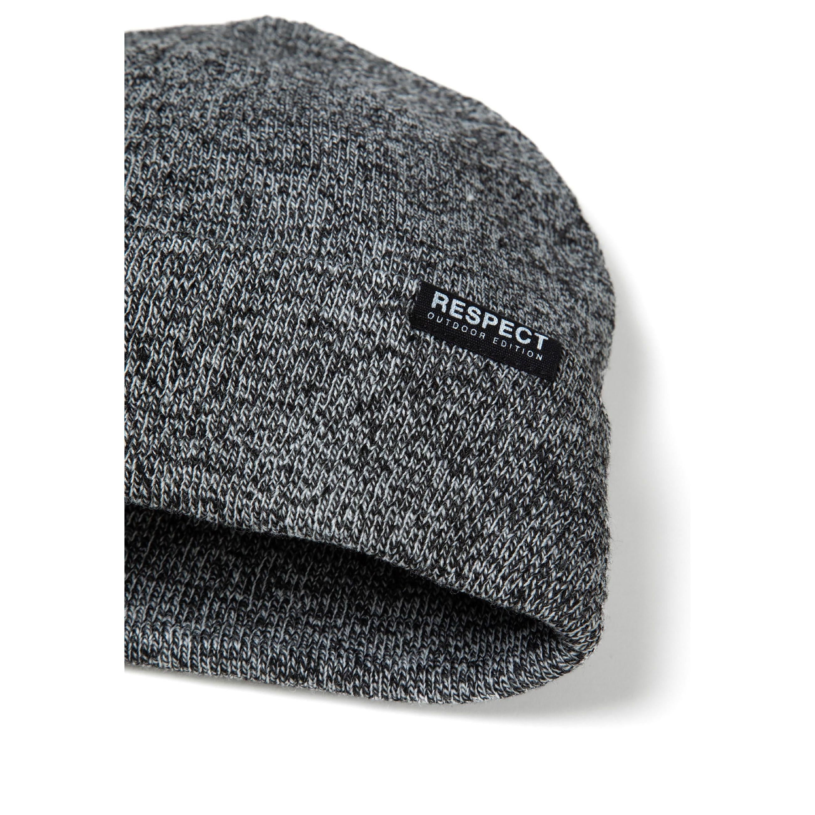Side angle view of grey knitted beanie showing ribbed texture and Respect badge placement on white background
