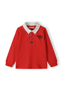 Boys long sleeve polo shirt in red with woven collar and chest graphic.