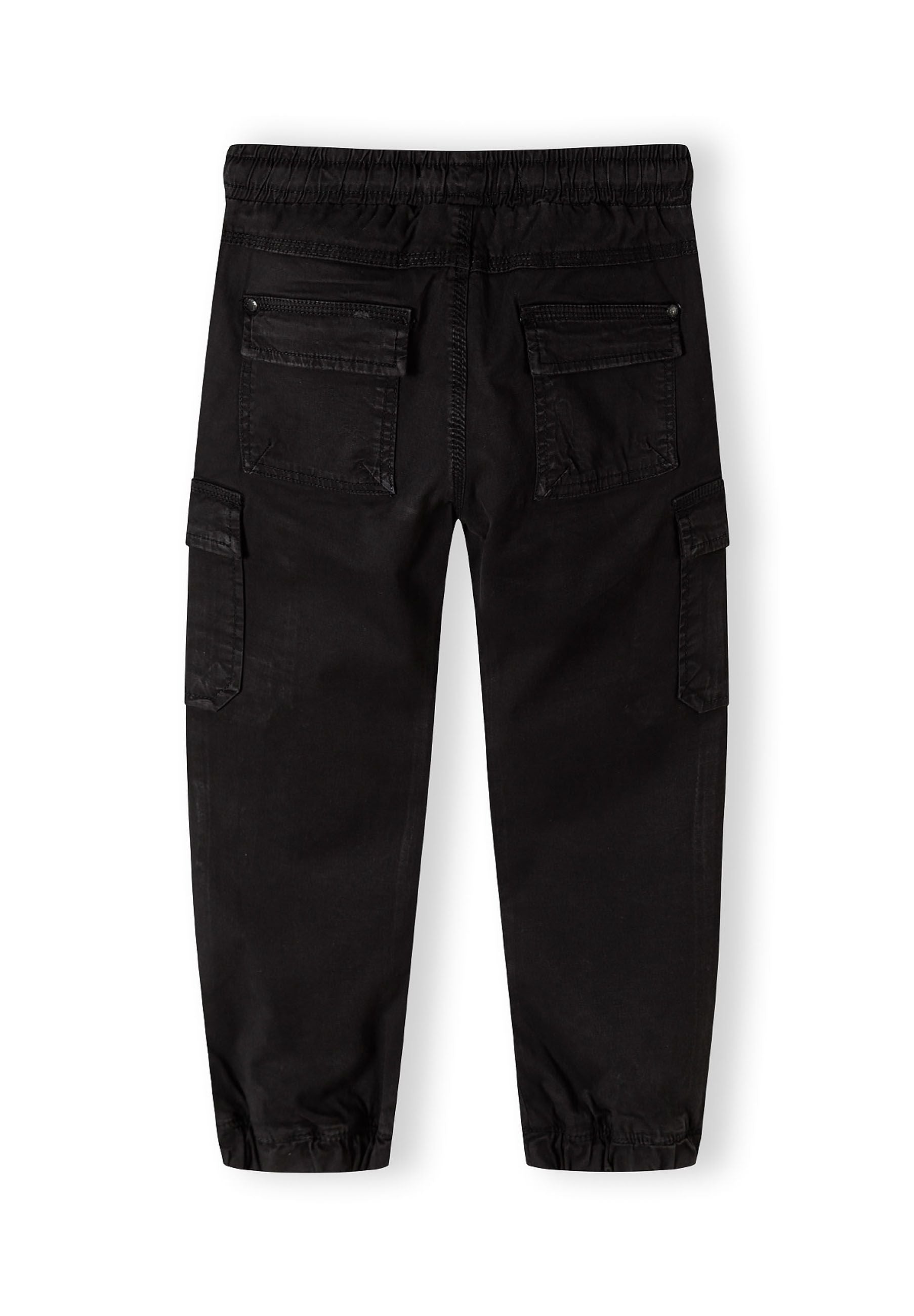 Boys black cargo trousers, back view, featuring elasticated waistband and side pockets.