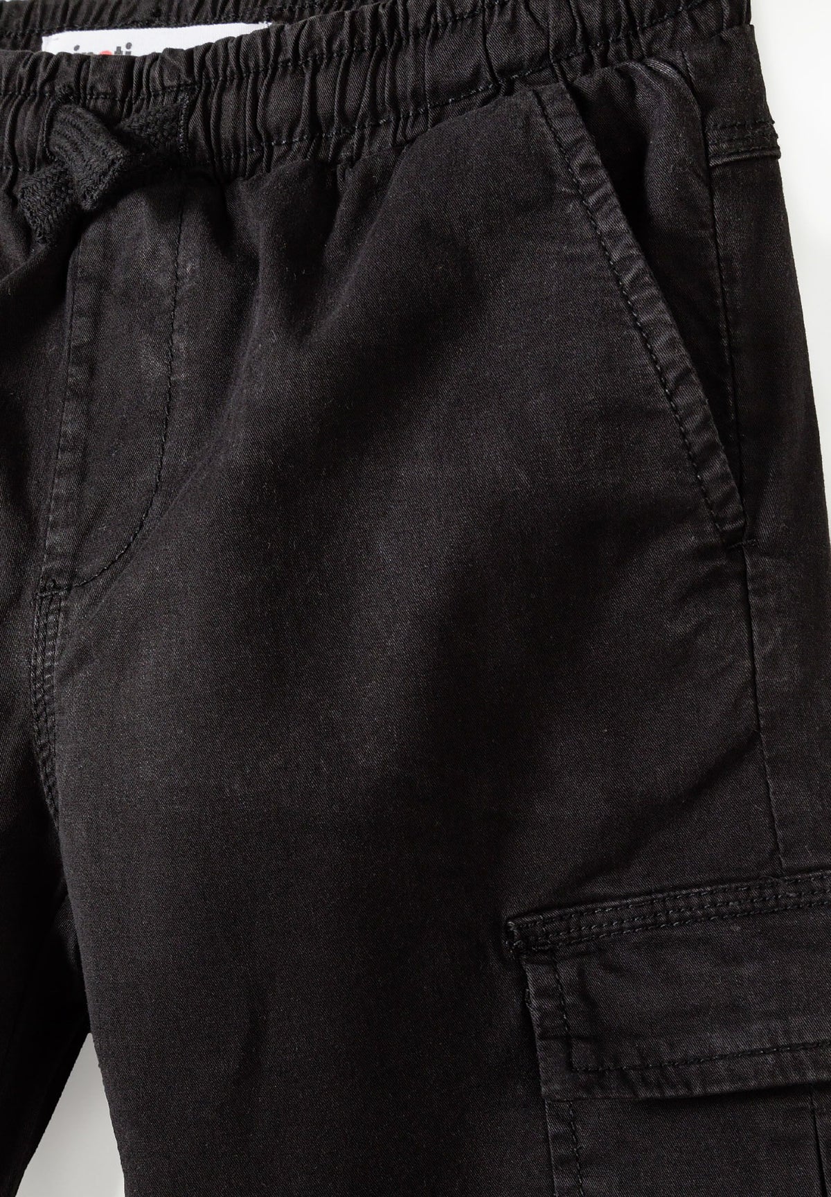 Black cargo trousers, waist tie and side pocket.
