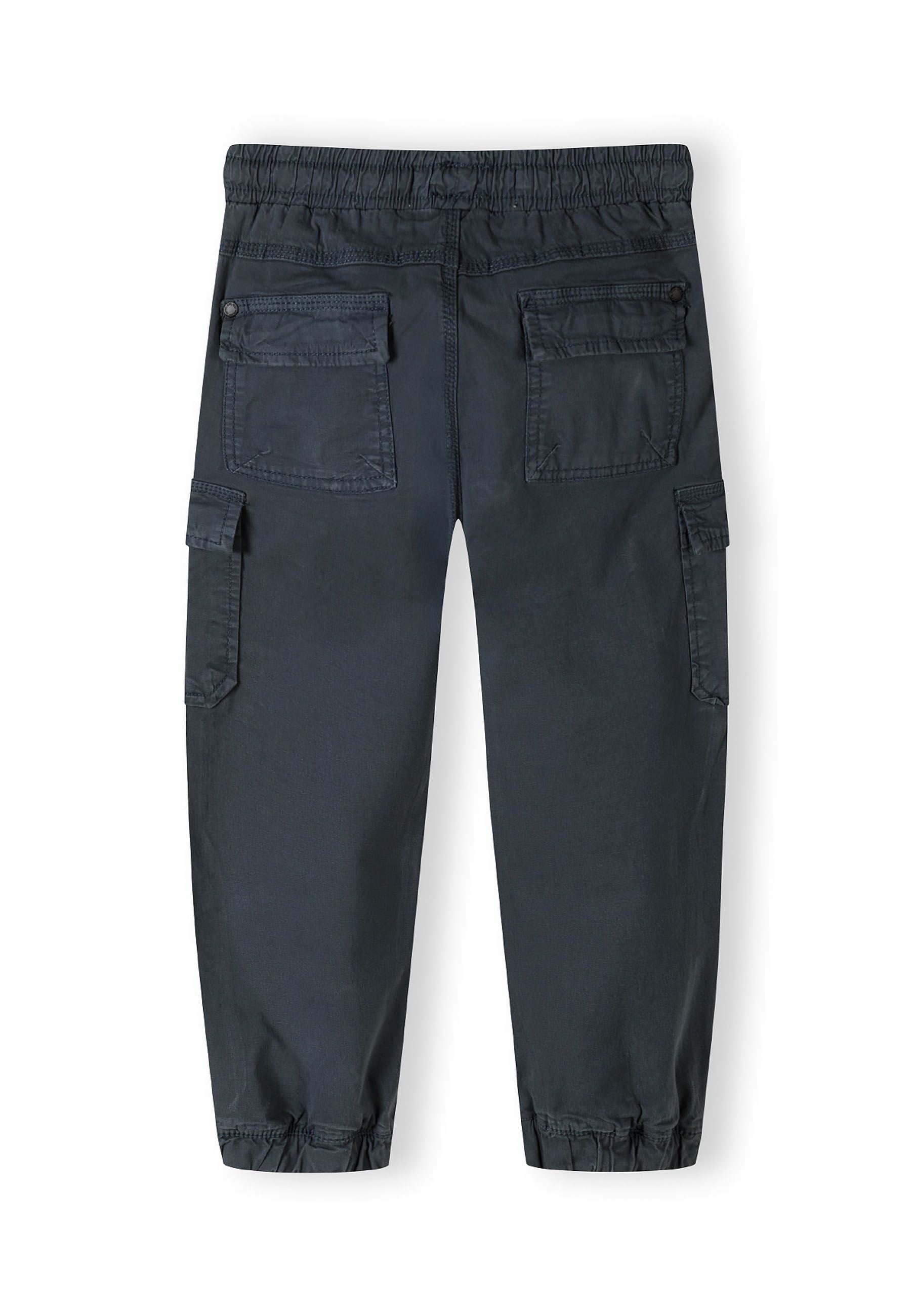 Boys cargo trousers, blue, back view with elastic waistband and cargo pockets.