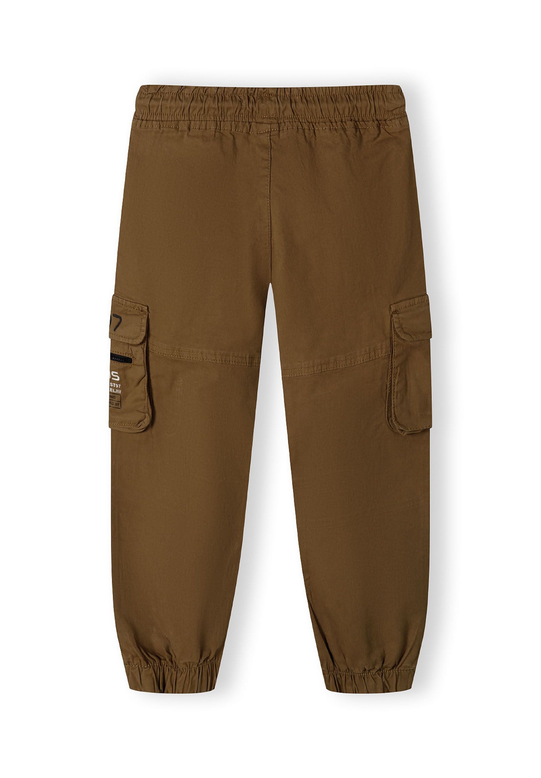 Boys cargo trousers in brown, back view with elasticated ankle cuffs and side cargo pocket.