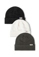 Three ribbed knit beanie hats in black, white, and dark green with folded brims and logo badges.