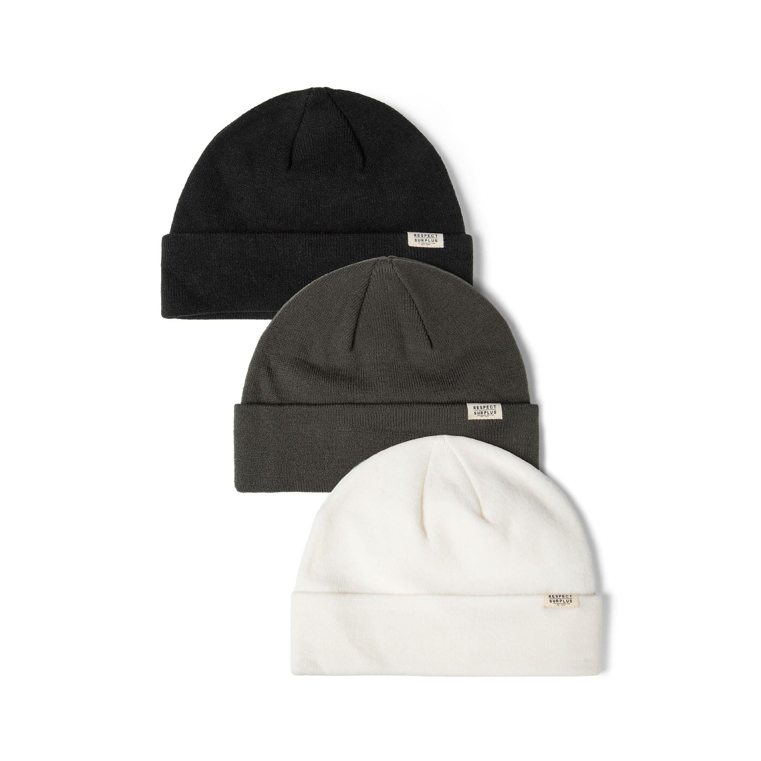 Set of 3 ribbed cuffed beanies in black, khaki, and white with subtle badges.