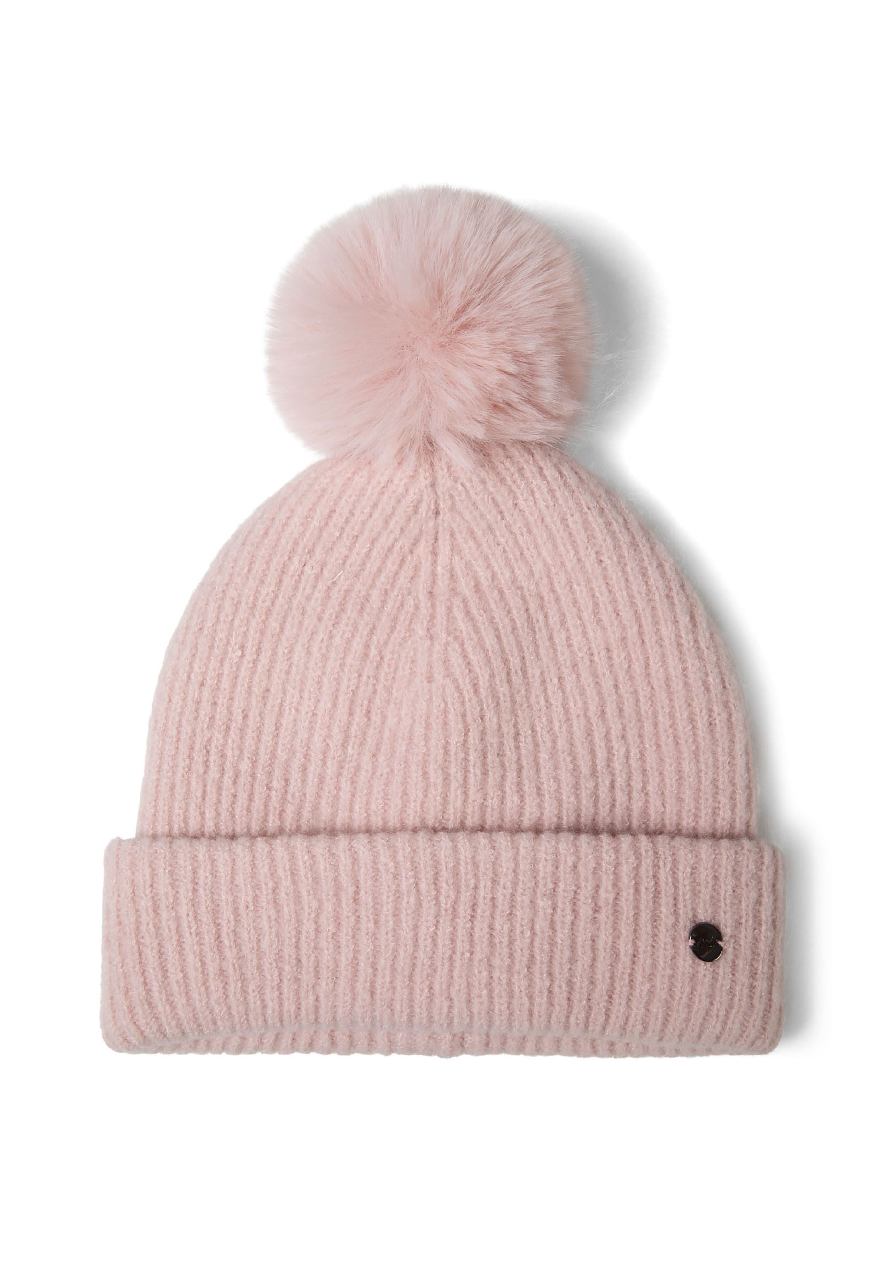 Close-up of a pink ribbed knit hat with a soft pompom and metal badge.