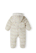 Girls baby snowsuit in cream with floral pattern, back view, features fixed hood and double zip.