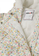 Detail of a girls baby snowsuit with floral pattern, fixed hood, and double zipper.
