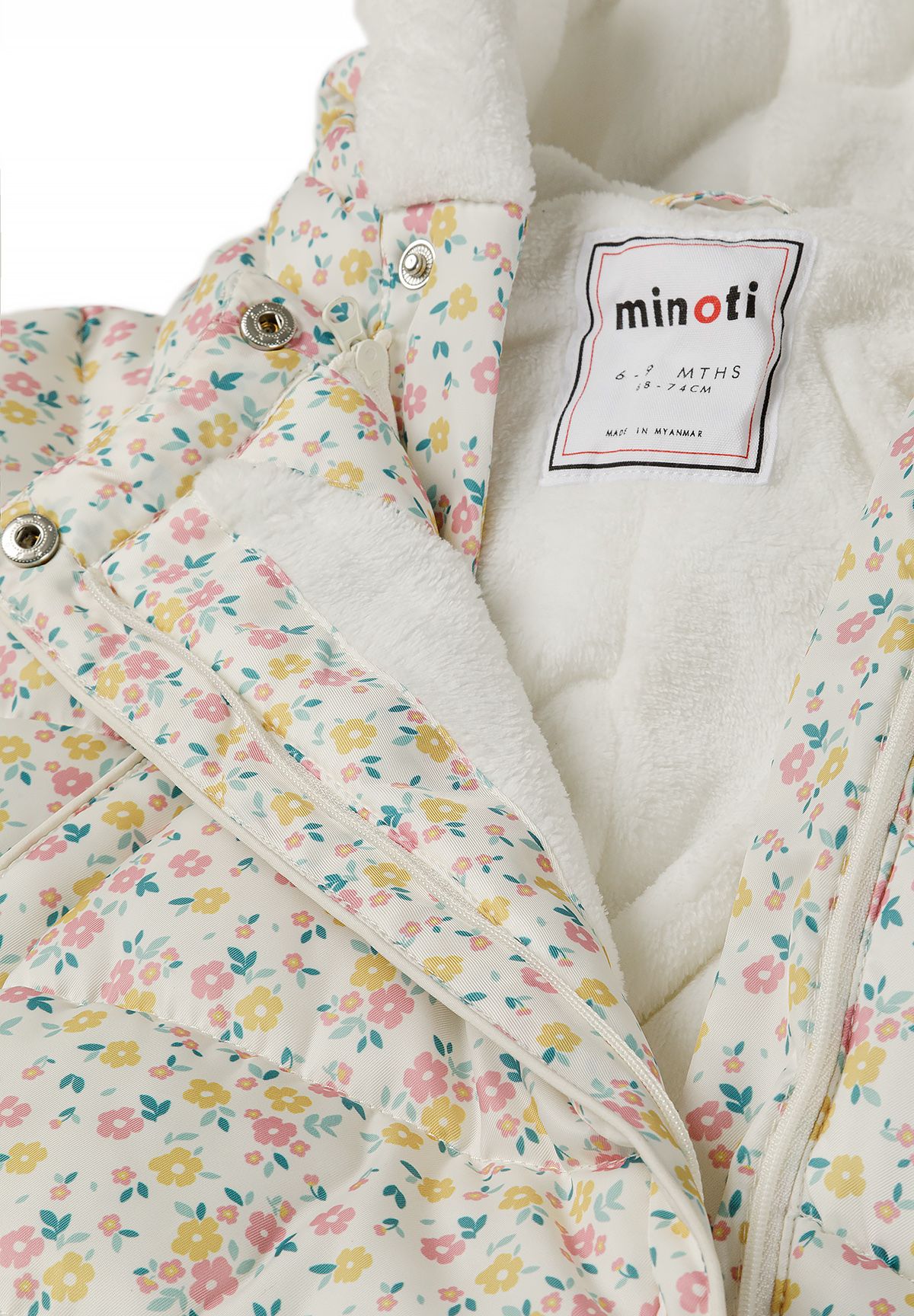 Cream padded pramsuit, zip and lining detail.
