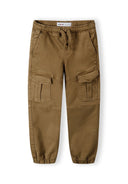 Boys knitted cargo trousers in brown, front view with drawcord and multiple pockets.