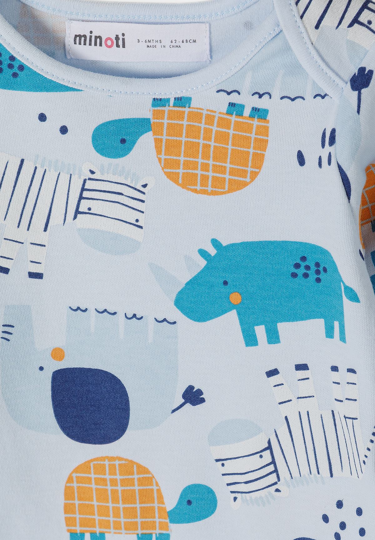 Babyblauwe hemdjes met lange mouwen en dierenprint (set van 7), detail van de dierenprint.