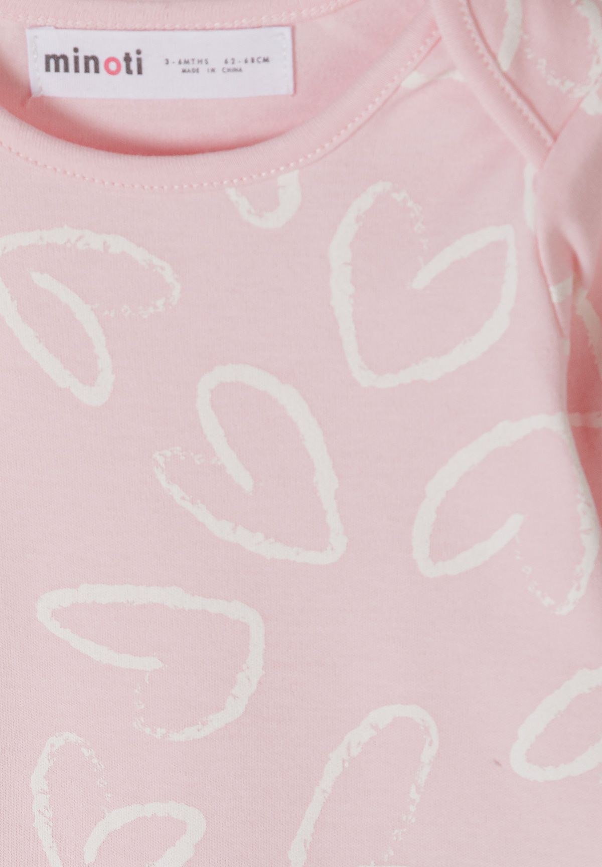 Babyroze, witte en grijze hemdjes met lange mouwen en eenhoornprint (set van 7), detail van de roze print.