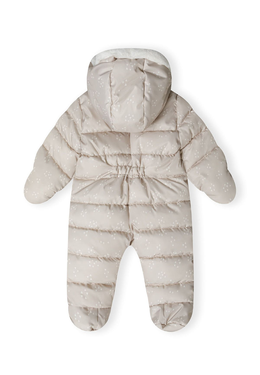 Back of beige baby snowsuit with white triangle print and gathered waist seam.