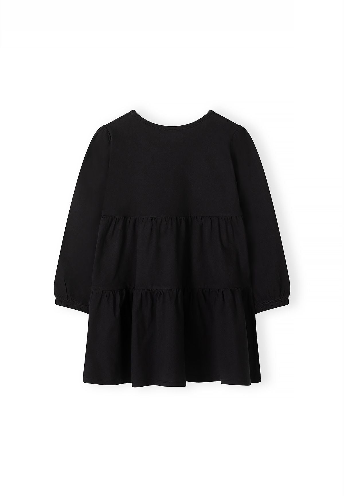 Back of plain black long-sleeved dress with two gathered skirt tiers.