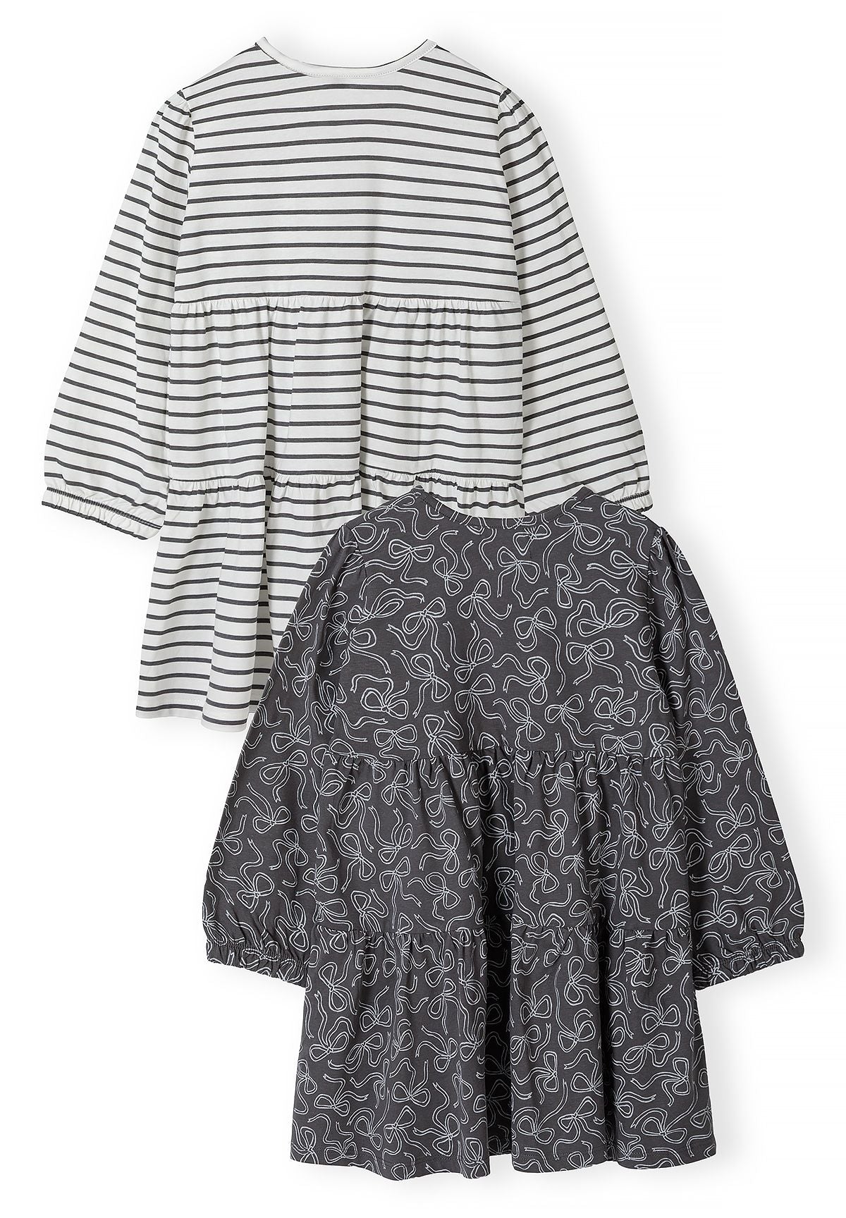 Back of charcoal bow-print and white striped long-sleeved tiered dresses.