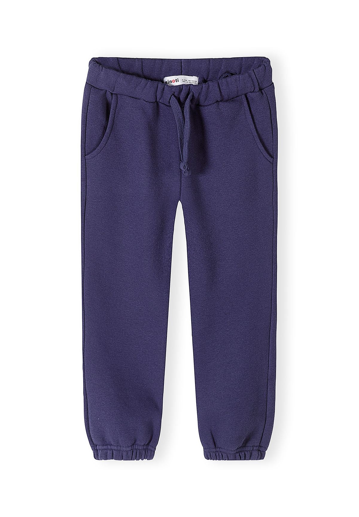Survêtement pour fille composé d'un sweat-shirt bleu foncé à volants et d'un pantalon de jogging, vue de face.