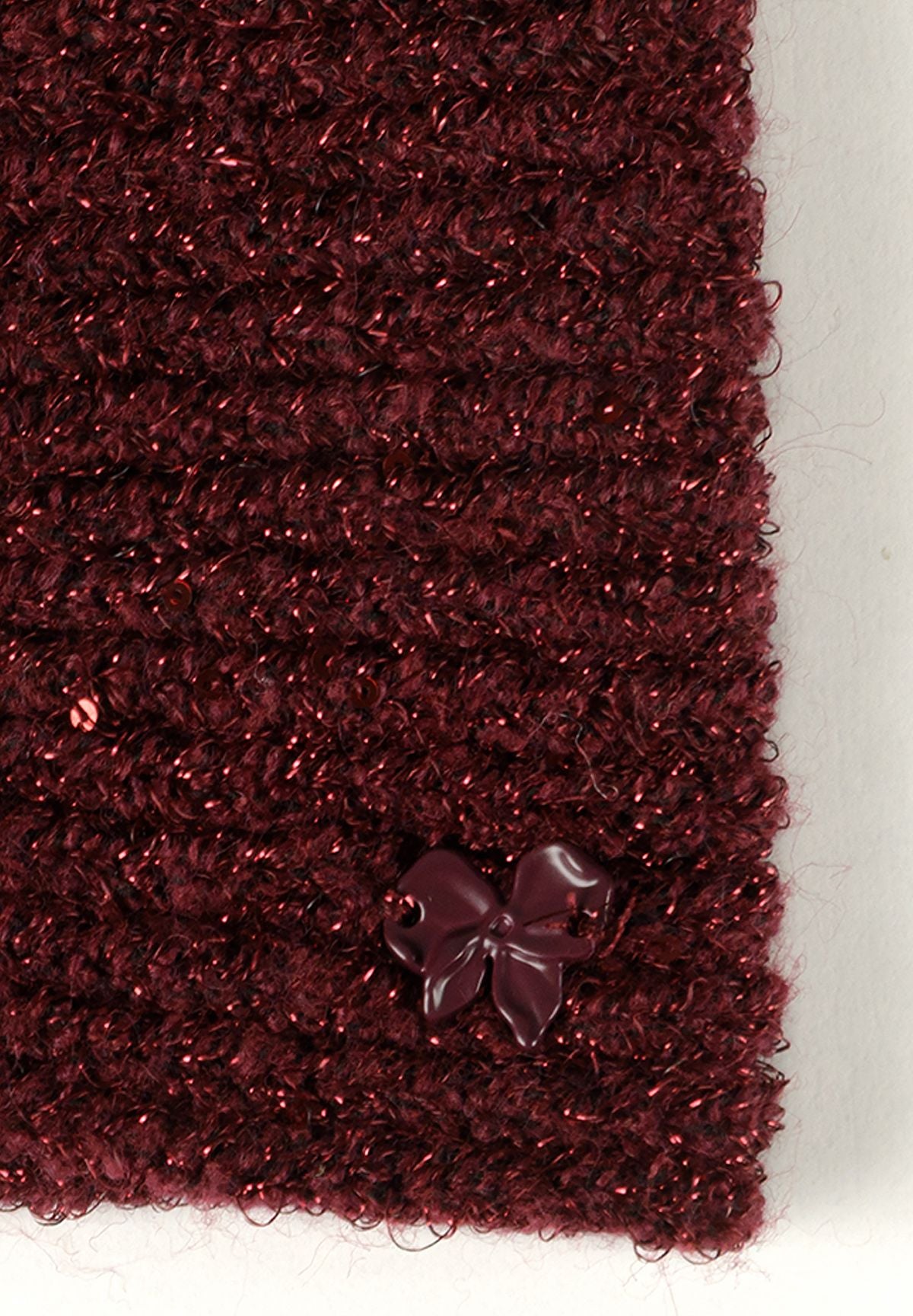 Bordeauxrode en roze glinsterende gebreide haarbanden voor meisjes (set van 2), detail van de bordeauxrode glinsterende gebreide haarband.