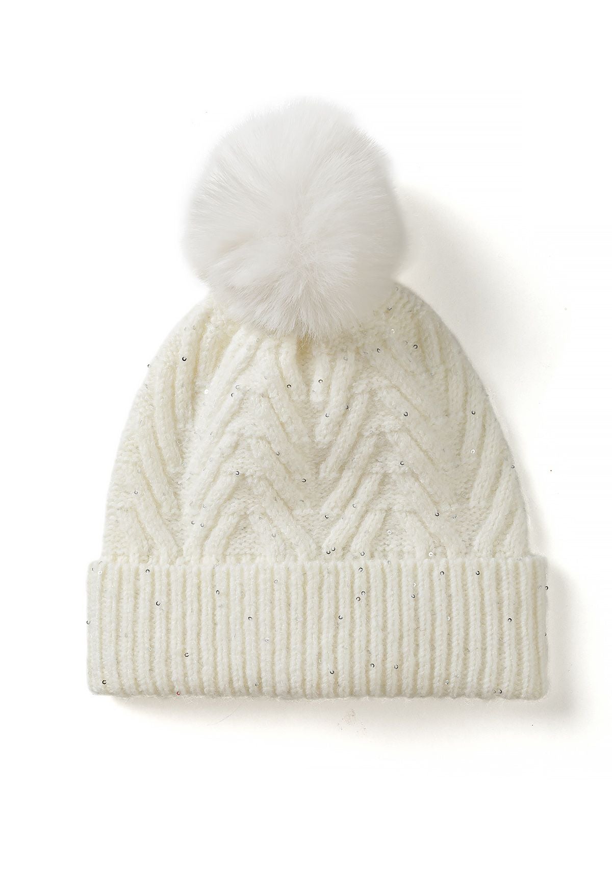 Cream chevron-knit beanie with scattered sequins, a folded ribbed brim and a large fluffy pom.