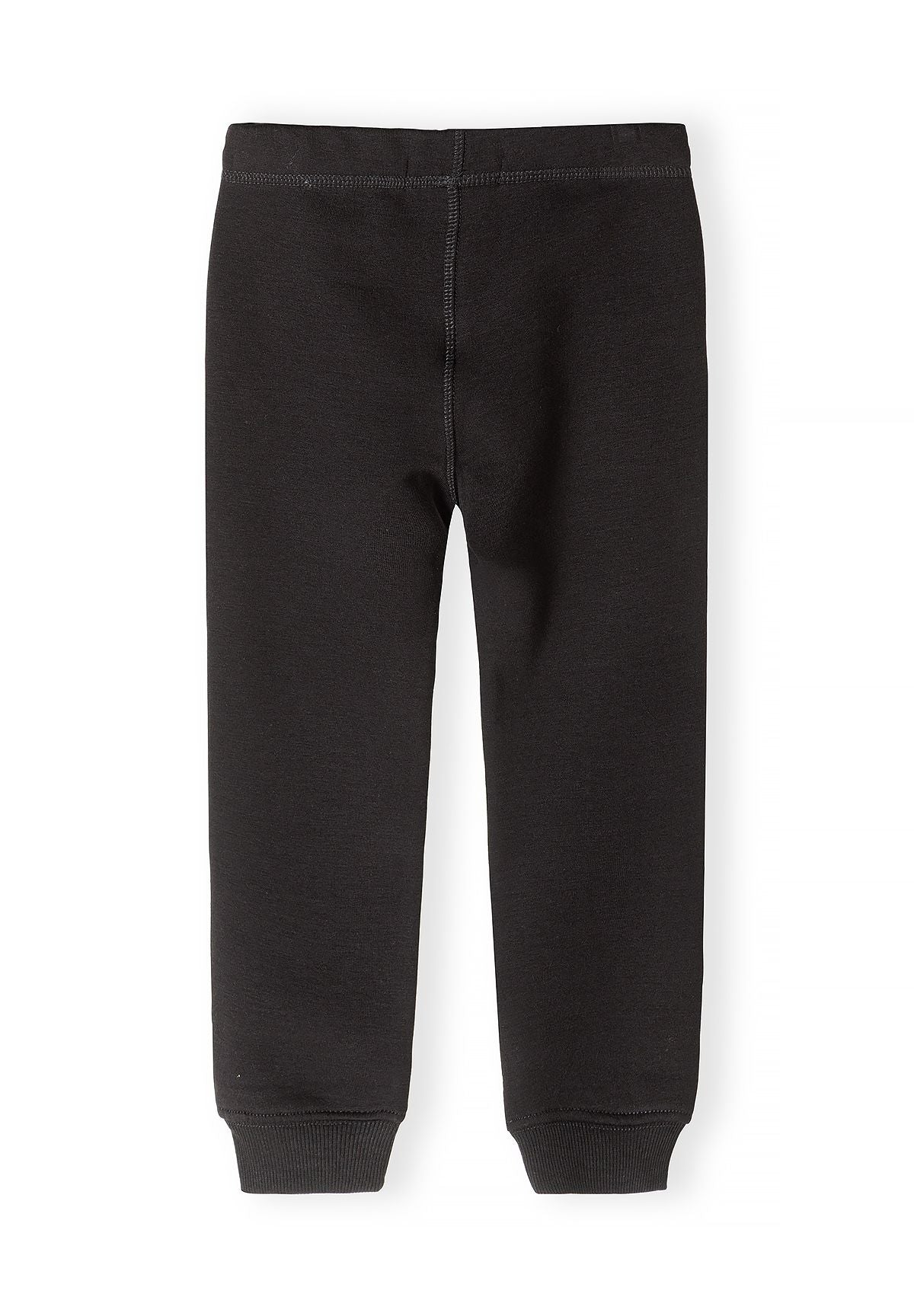 Back of a single pair of plain black leggings with a central seam and ribbed ankle cuffs.