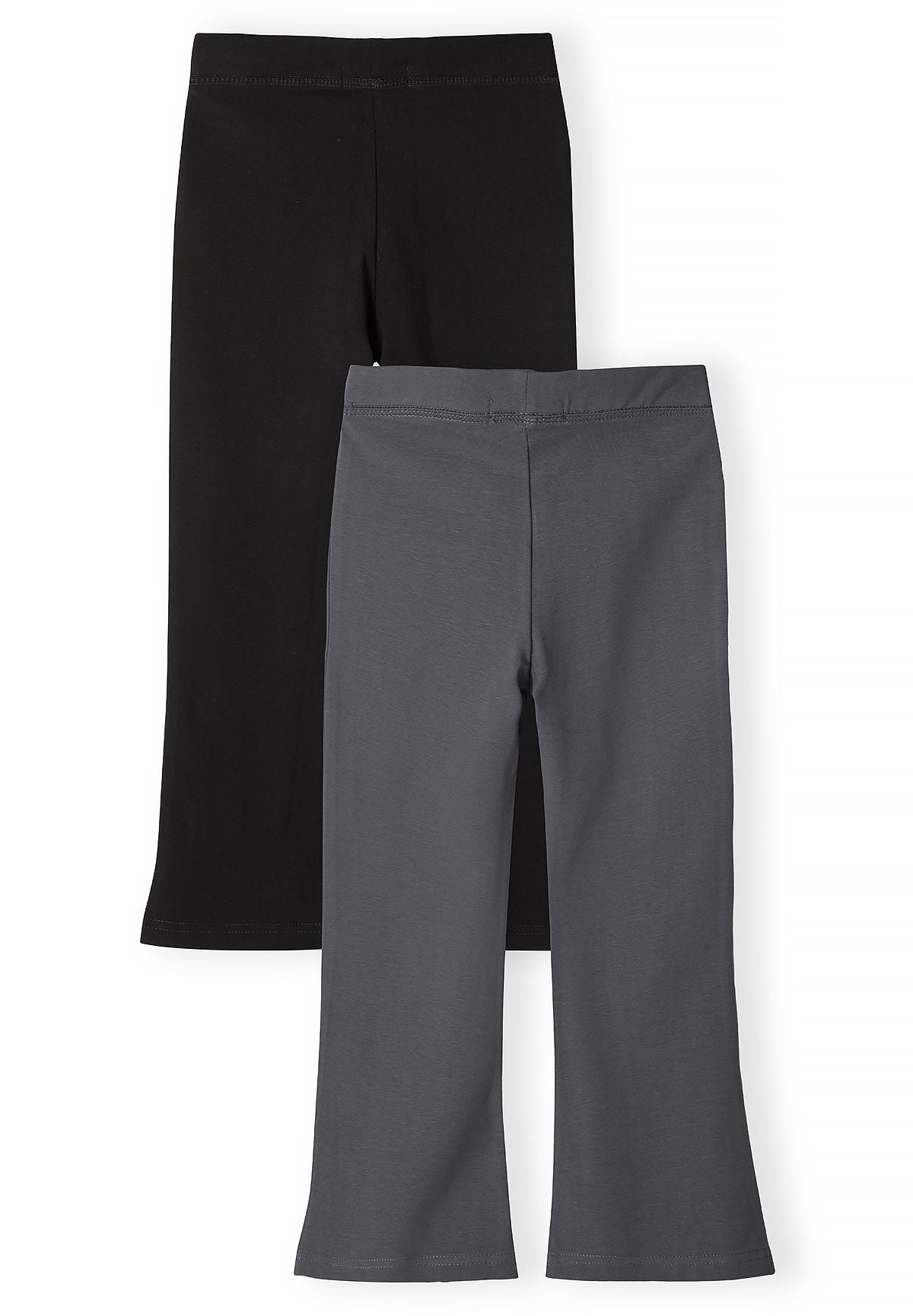 Backs of black and charcoal grey leggings with gently flared hems.