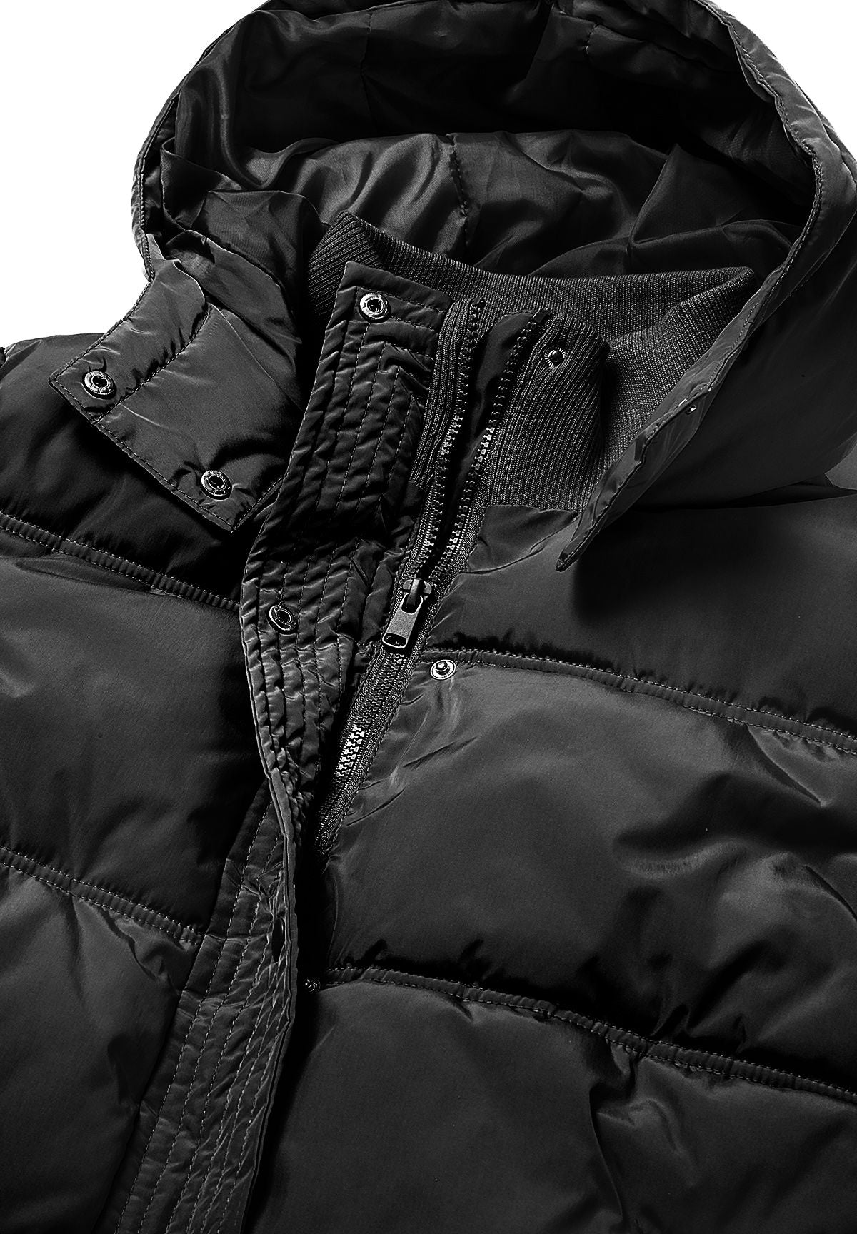 Detail of the black jacket's centre zip, tall ribbed collar and metal-toned snaps under its hood.