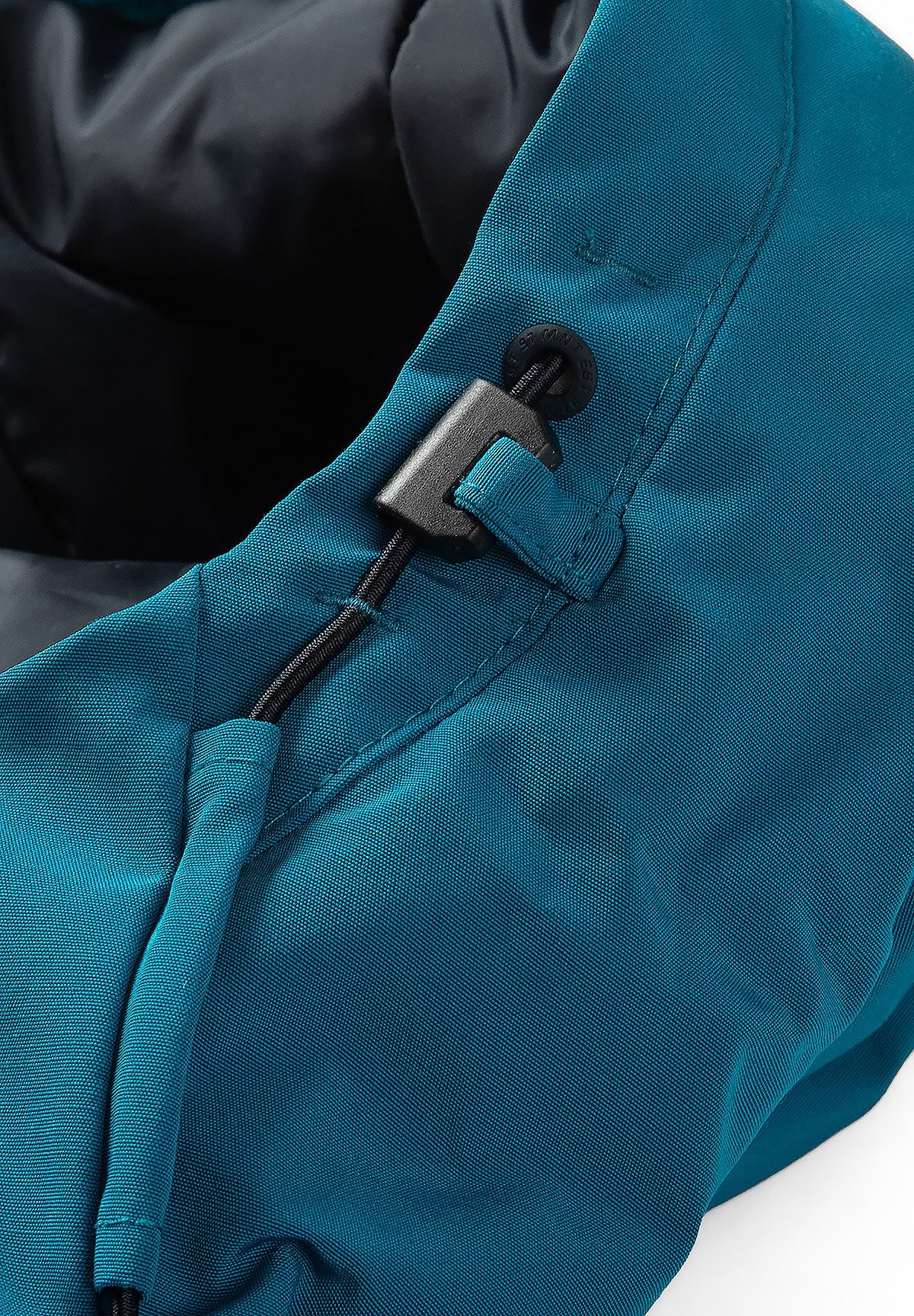 Close-up of the teal hood's dark drawcord, eyelet and sliding adjuster above dark lining.