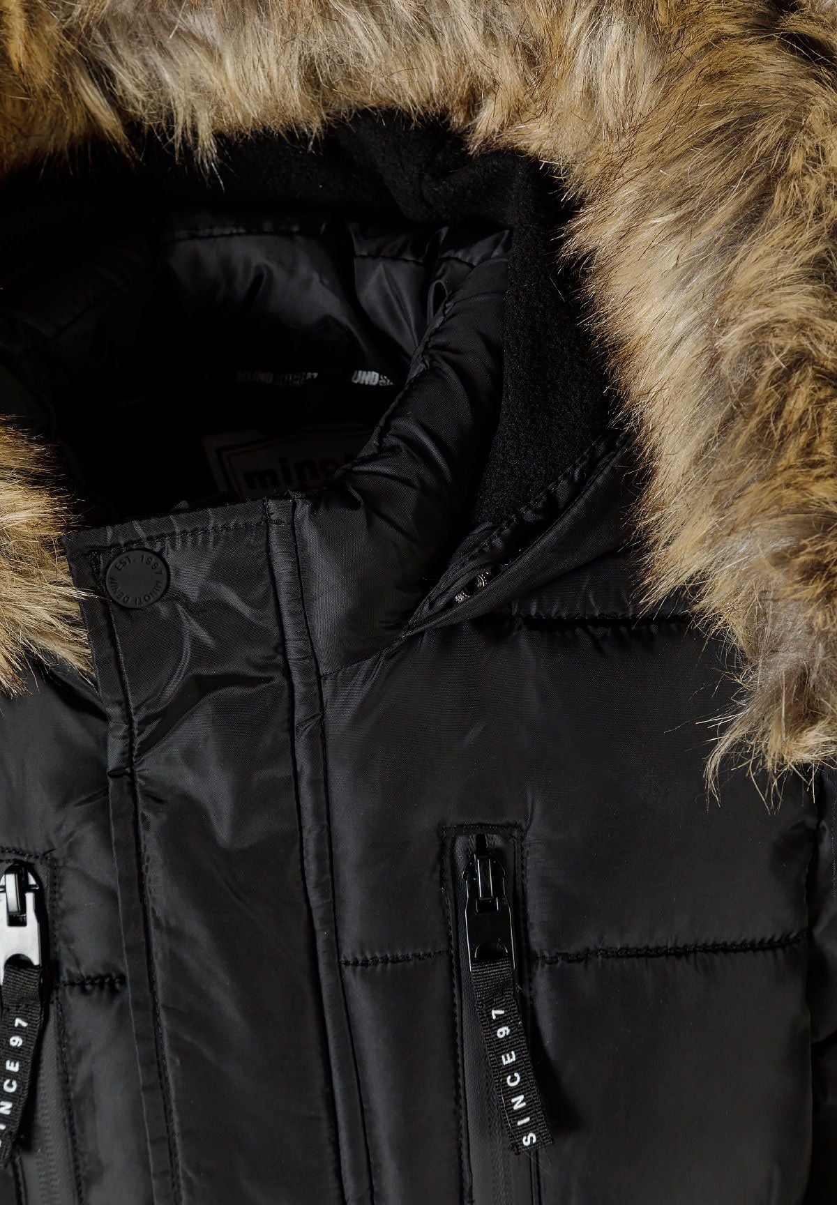 Close-up of the black parka hood with thick brown fur-look trim and padded dark interior.