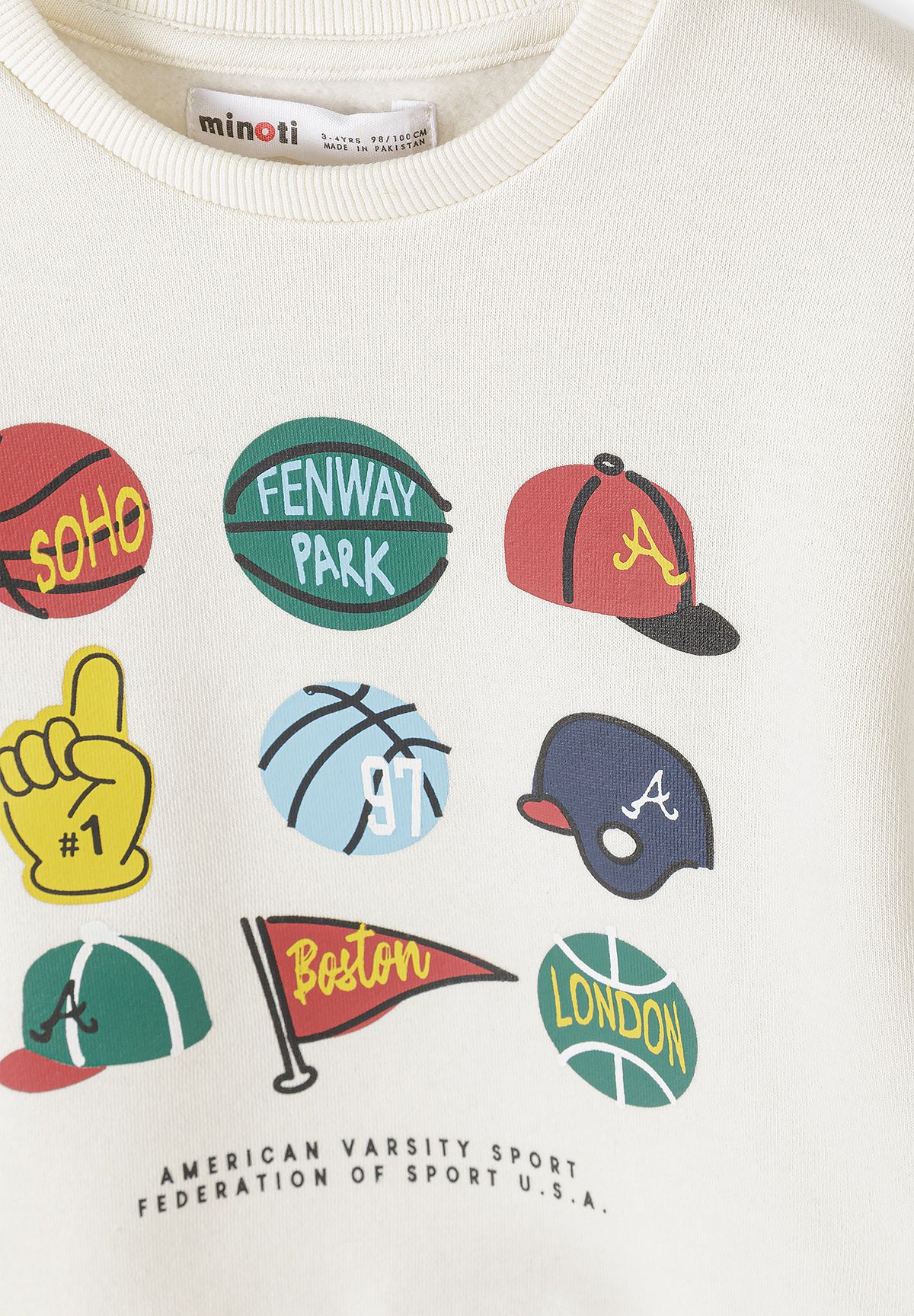 Cream sweatshirt print close-up with sports balls, caps, foam finger and pennant.