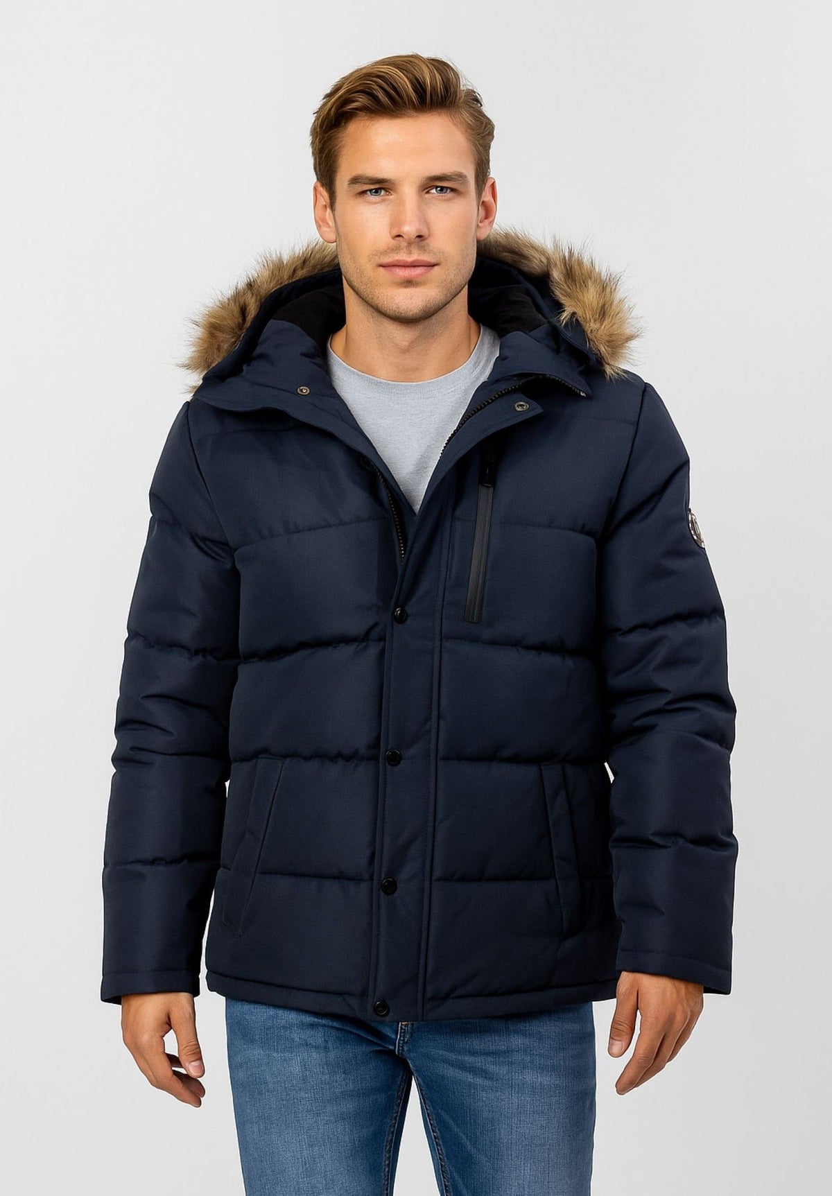 Men's navy puffer jacket, shown worn.