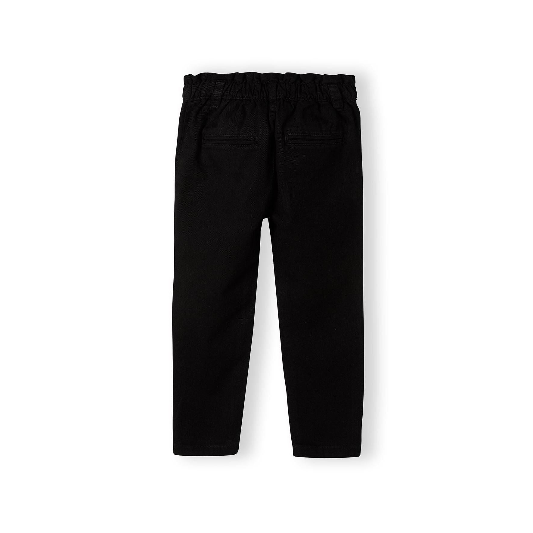 Black denim jeans laid flat showing back view with elasticated waistband and back pockets on white background