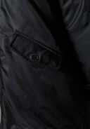 Black girls longline parka jacket featuring a secure flap pocket with popper fastening. Ideal for ages 3-14y.