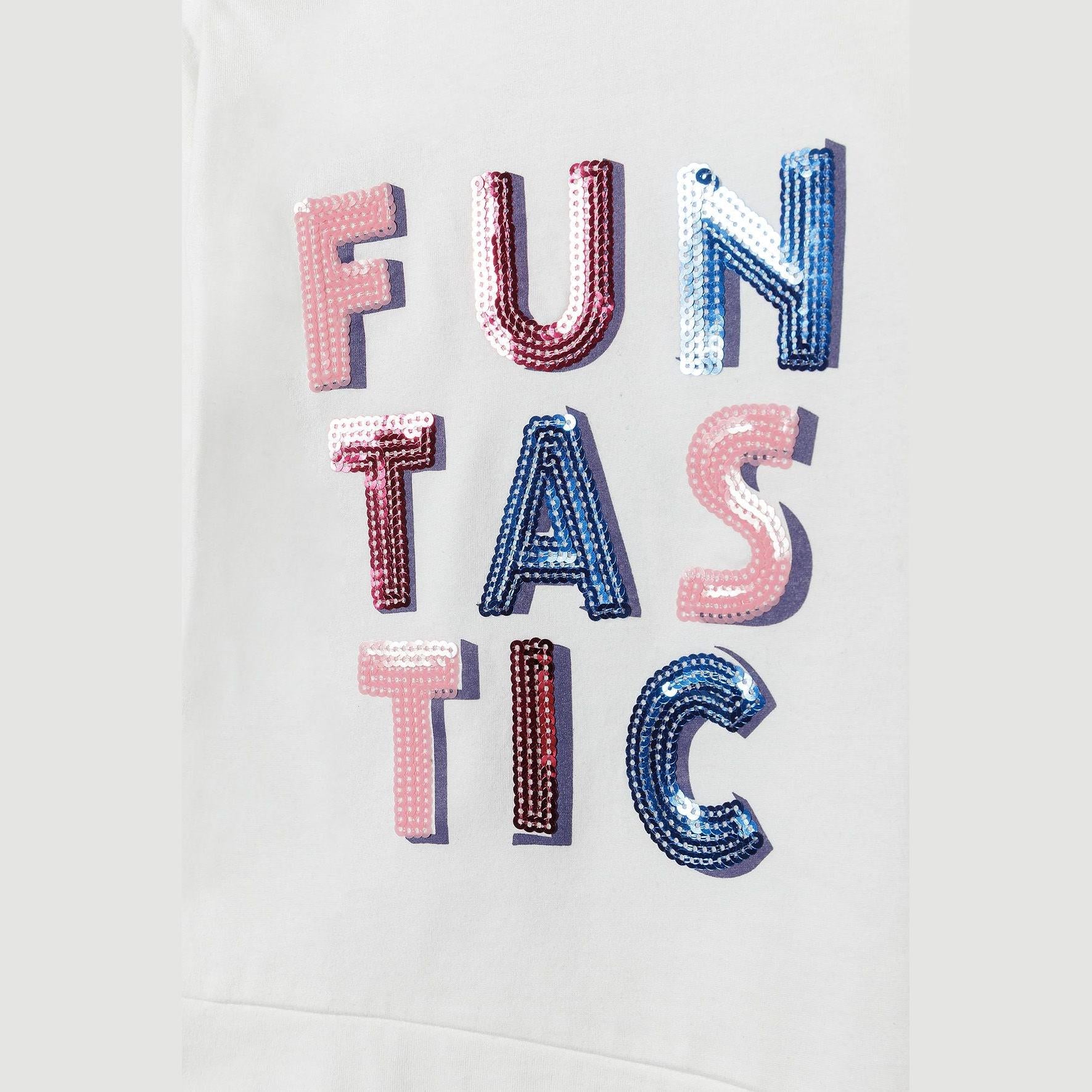 Close-up detail of multicoloured sequin letters spelling FUNTASTIC on cream fabric background showing pink, burgundy and blue sequins
