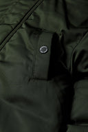 Boys parka jacket with fur trim hood khaki 2-14y featuring a close-up of a khaki fabric and popper fastened pocket detail. 