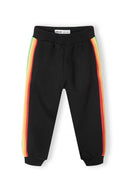 Black jogpants for girls featuring multicolour taping along the sides, soft fabric for comfort, designed for ages 3-14y.