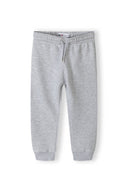 Boys jogpants fleece with drawcord grey 2-14y. Soft fleece material offers comfort and warmth, designed for active play and relaxation.