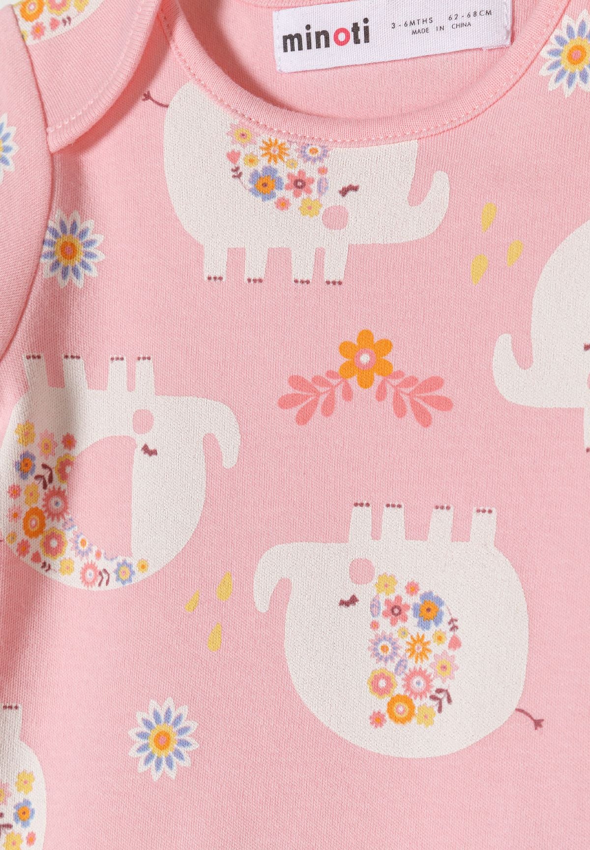 Pink, blue and cream short-sleeved bodysuits, elephant print detail.