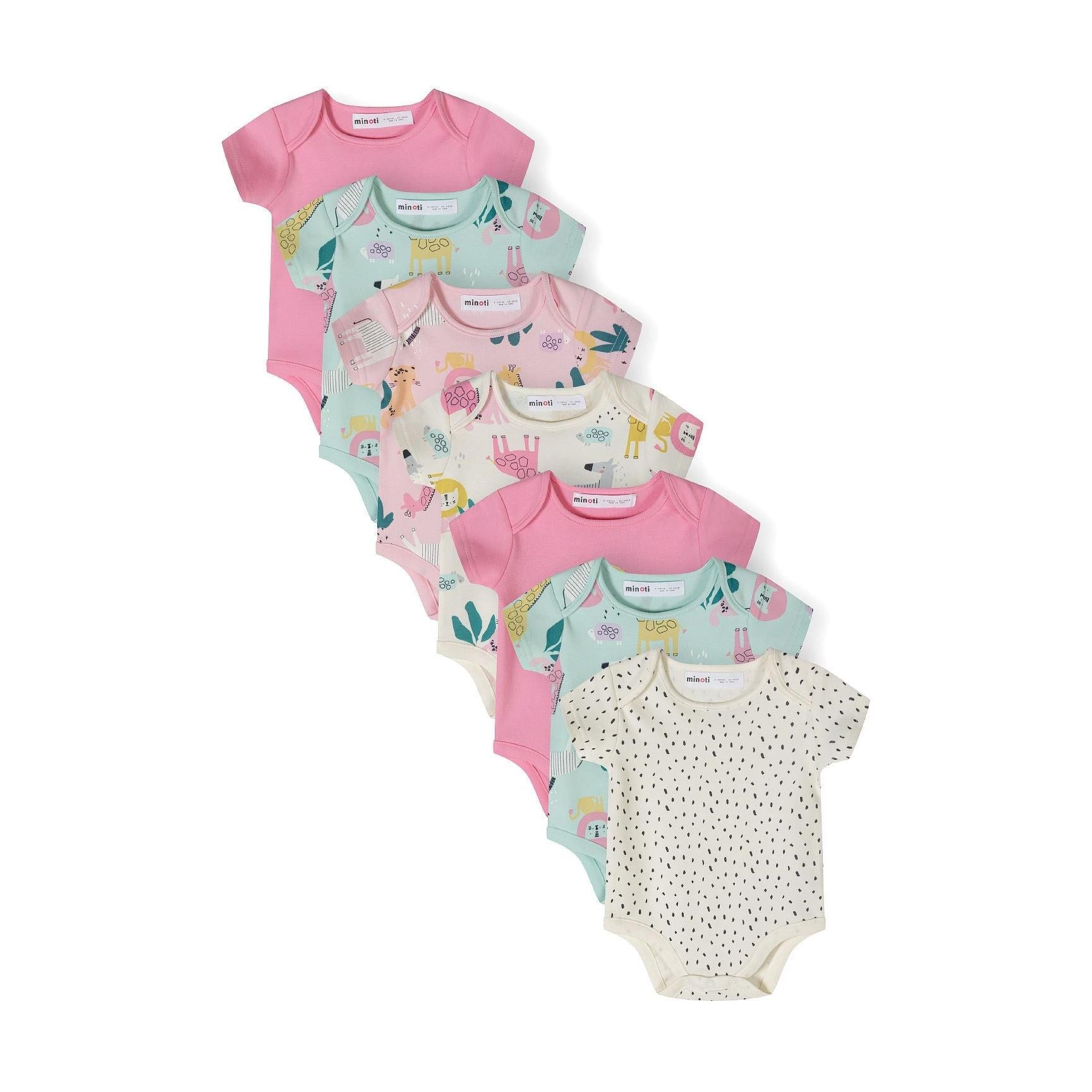 Seven short sleeve bodysuits arranged in a fan display showing variety of prints including solid pink, animal safari themes, and polka dots on white background