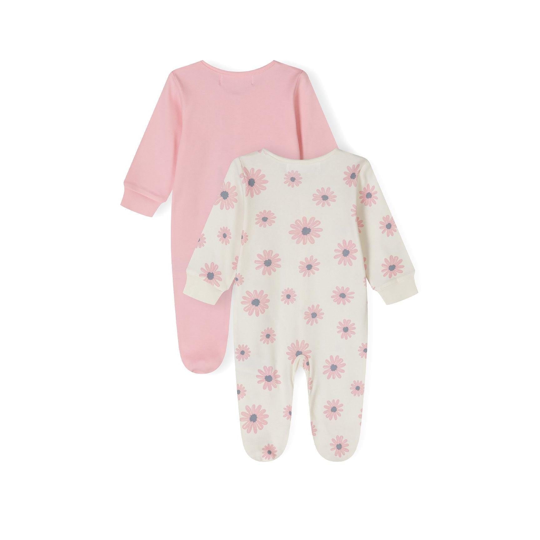 Close-up detail of pink sleepsuit with Minoti label showing white elephant motif with colorful flowers on chest area