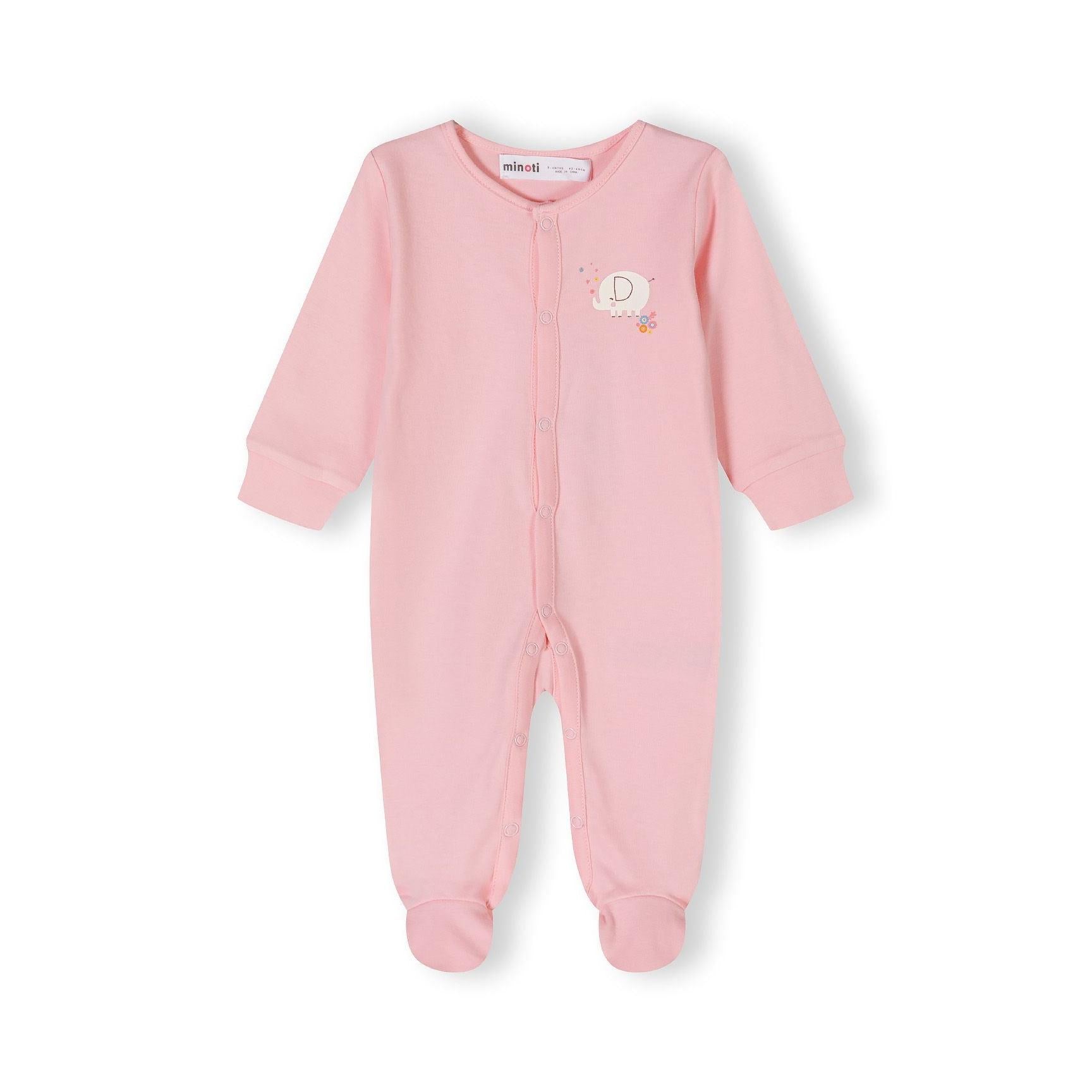 Close-up detail of pink sleepsuit with Minoti label showing white elephant motif with colorful flowers on chest area