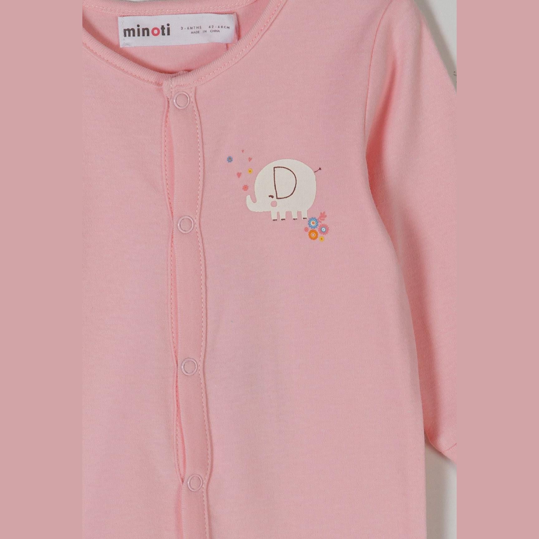 Close-up detail of pink sleepsuit with Minoti label showing white elephant motif with colorful flowers on chest area