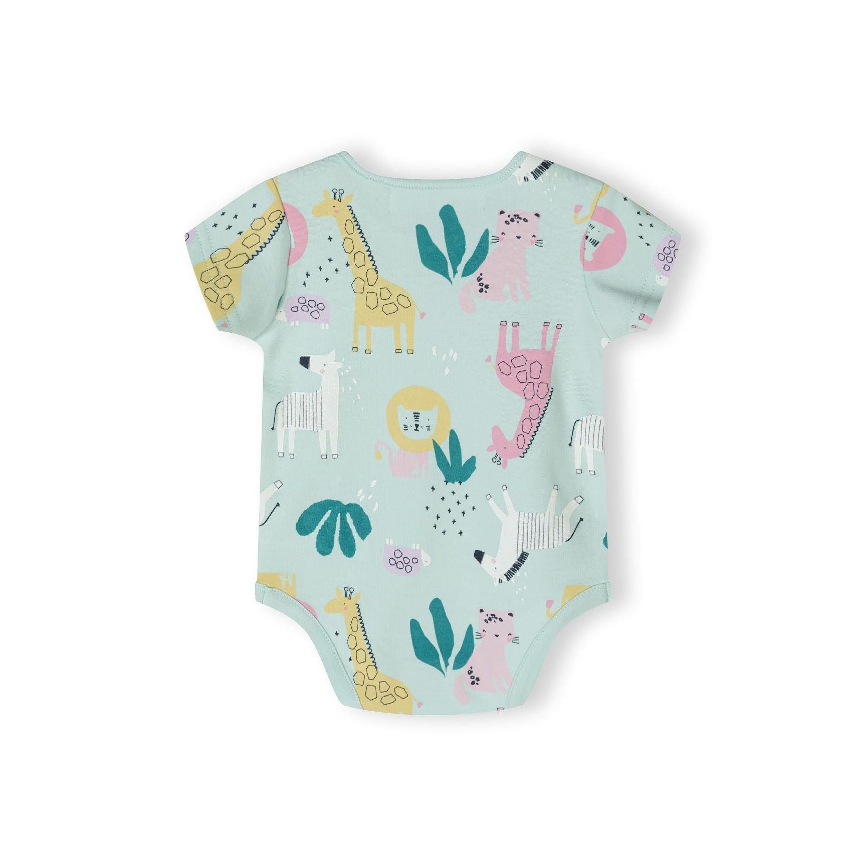 Close-up detail of pink bodysuit showing safari animal print with giraffe, lion, elephant and zebra characters with Minoti label visible