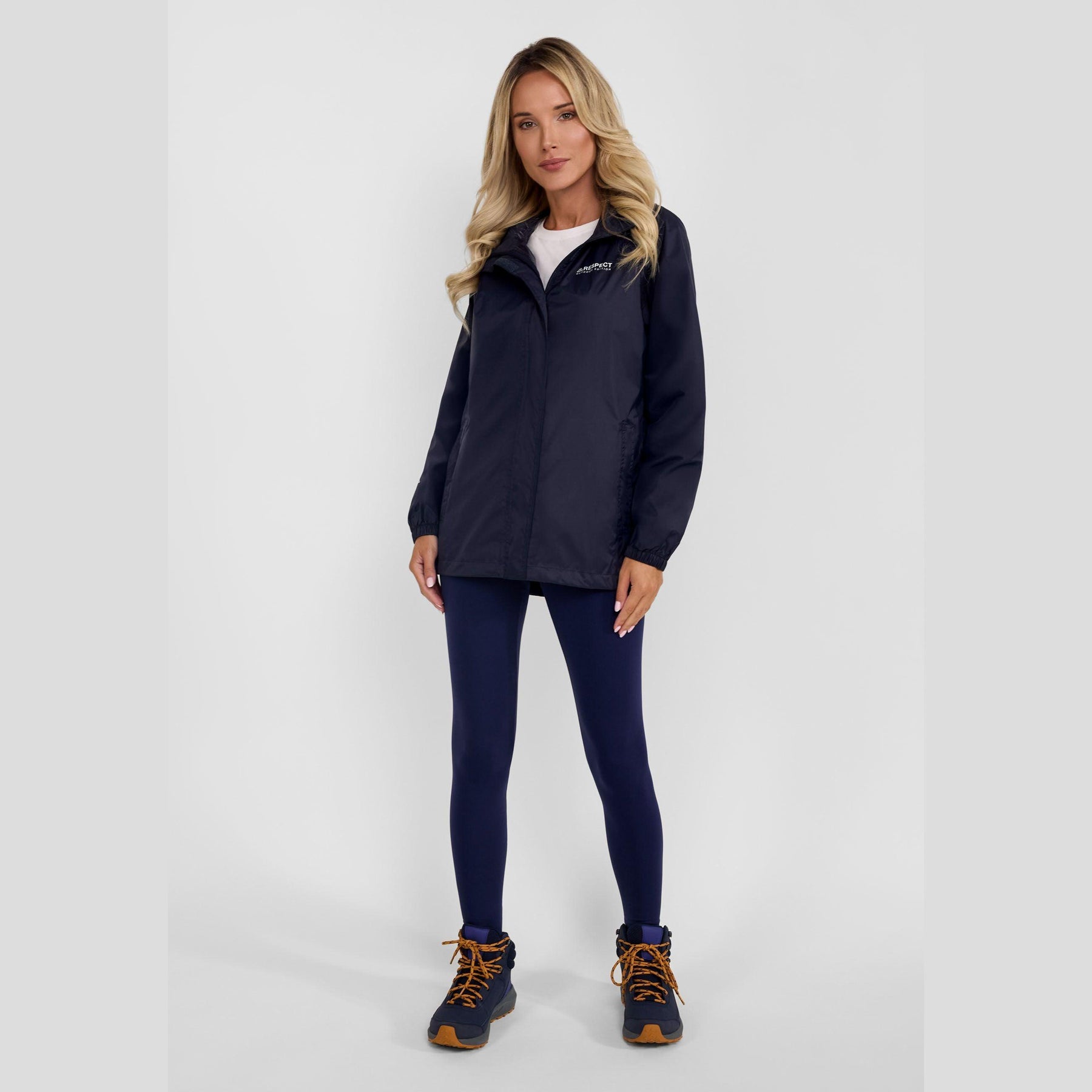 Navy packaway waterproof jacket laid flat showing full front view with zip fastening and Respect logo on chest