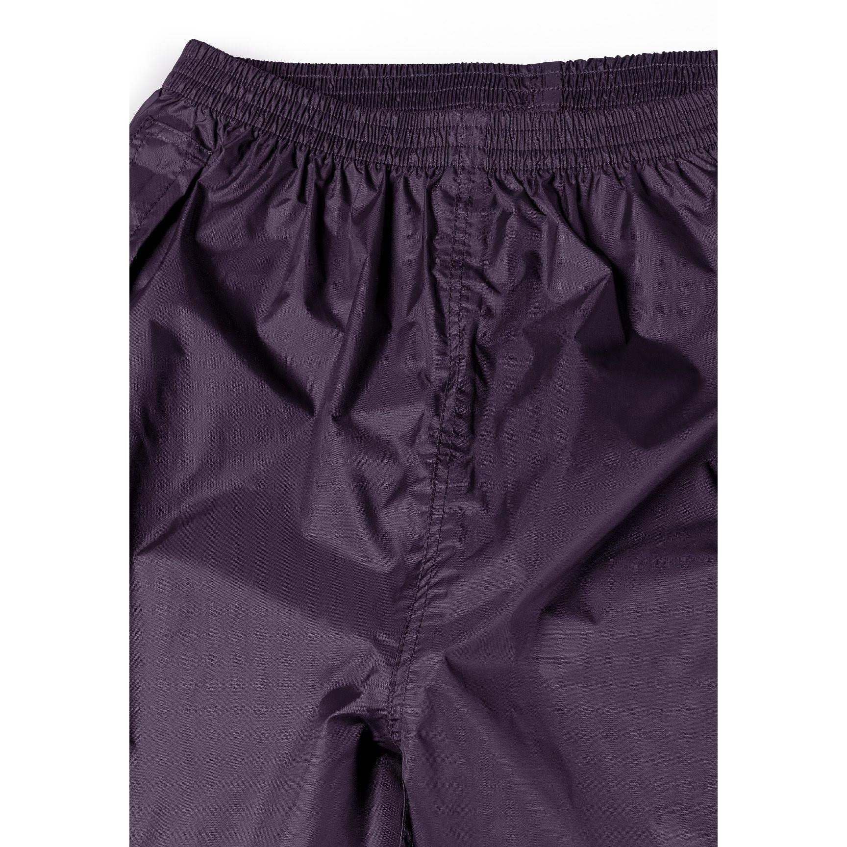 Close-up detail of purple waterproof overpants showing elasticated waistband with gathered fabric and seam construction