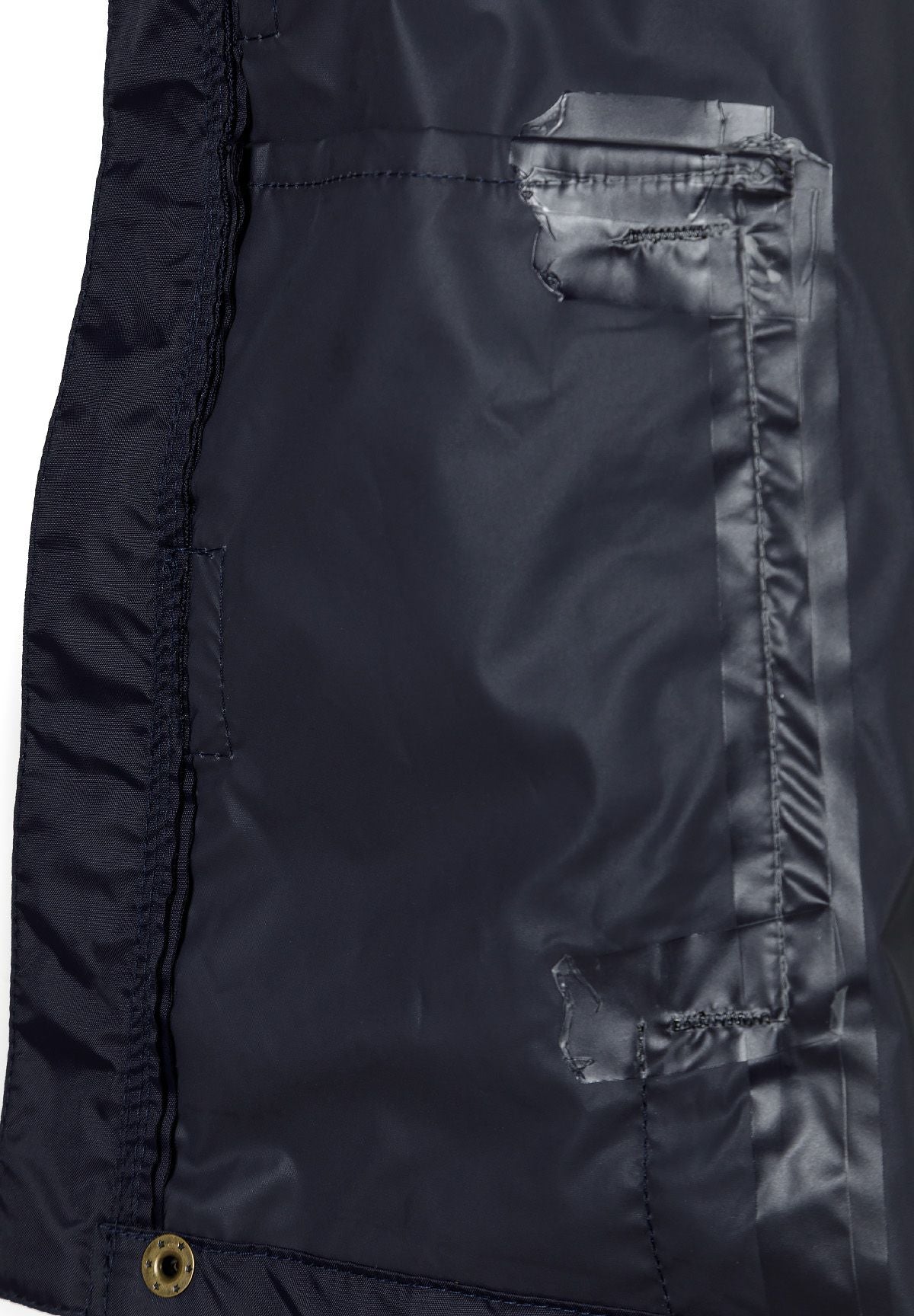Close-up of the inside placket on the navy packaway hooded jacket.