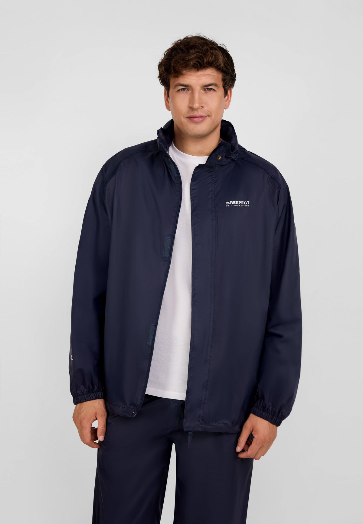 Men's navy packaway hooded jacket, shown worn.