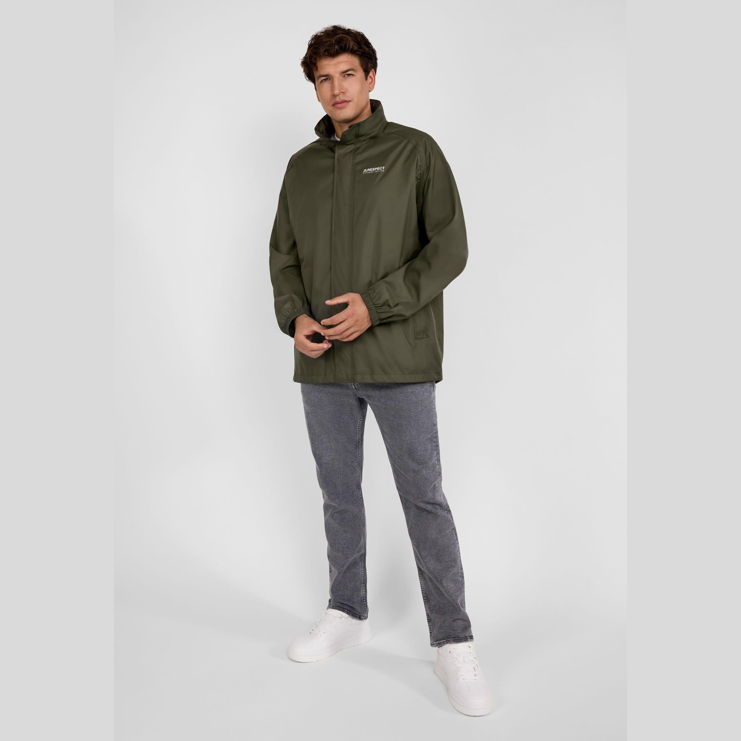 Close-up detail of khaki jacket side showing zip pocket with branded zipper pull and seam construction against white background