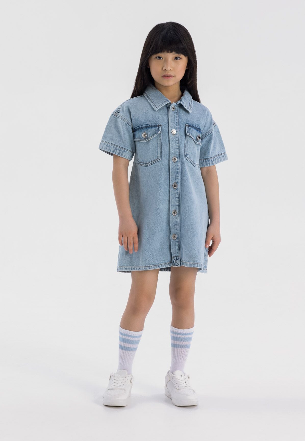 Light blue denim shirt dress, model front.